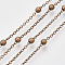 Brass Coated Iron Cable Chains, Satellite Chains, with Brass Round Beads, Soldered, with Spool, Flat Oval, Red Copper, 2.2x1.7x0.7mm, about 39.37 Feet(12m)/roll